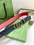 Gucci logo belt with round GG buckle, dark navy strap and red edge