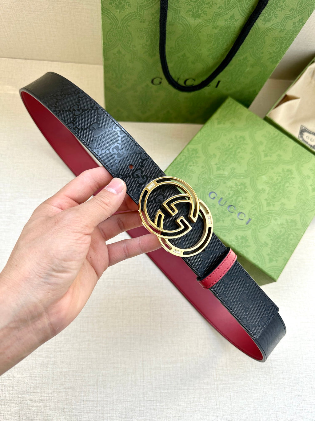 Gucci logo leather belt with round GG buckle, dark navy and red trim