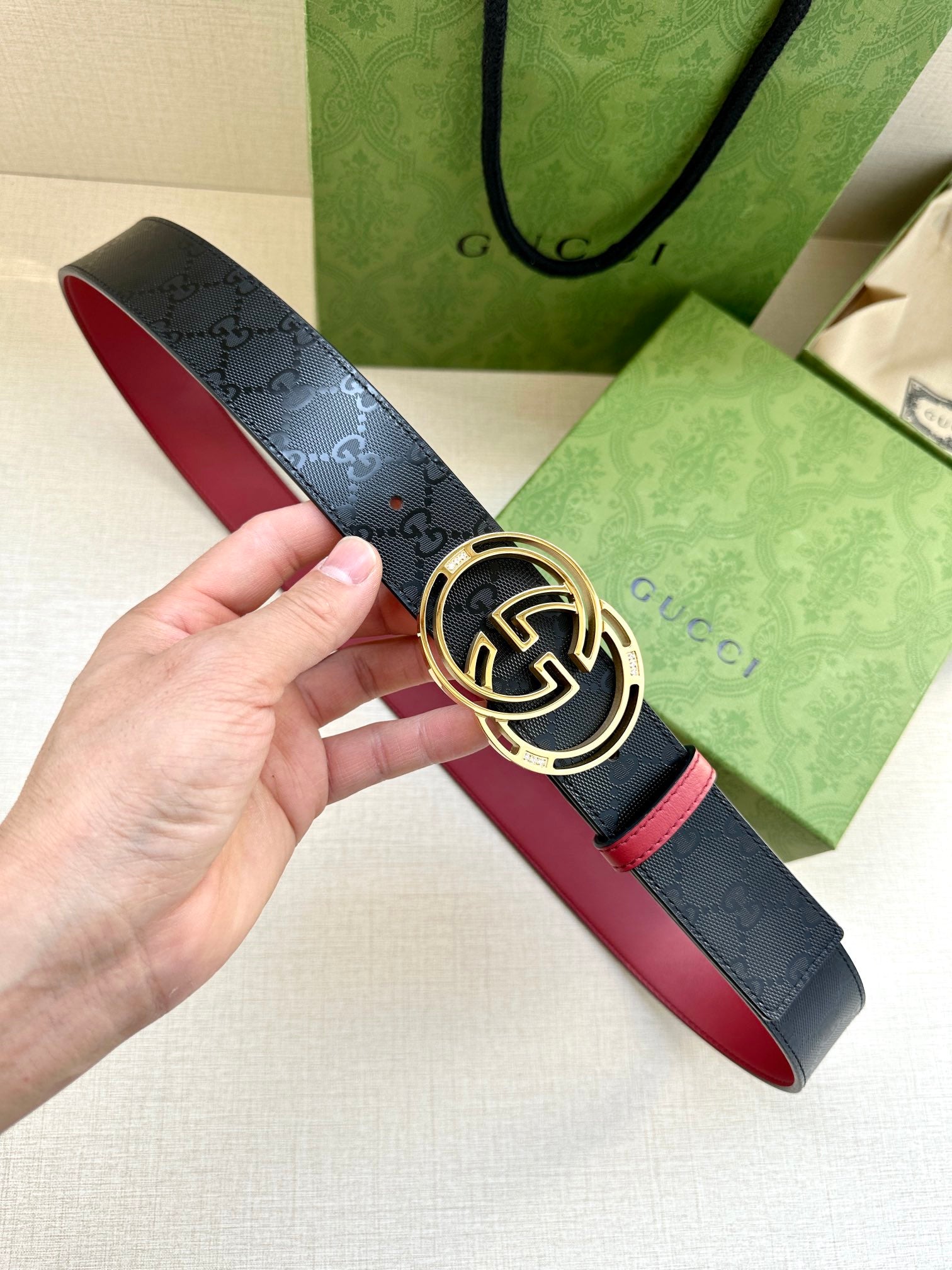 Gucci logo leather belt with round GG buckle, dark navy and red trim