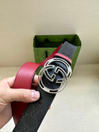 Gucci logo leather belt with large round GG buckle, dark navy and red strap