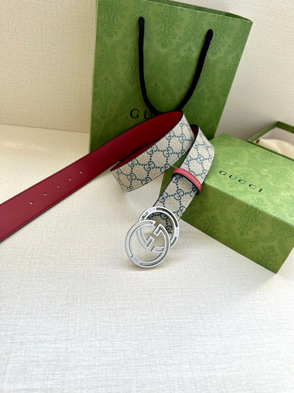 Gucci belt with blue GG canvas and silver-tone double-G buckle, red leather strap