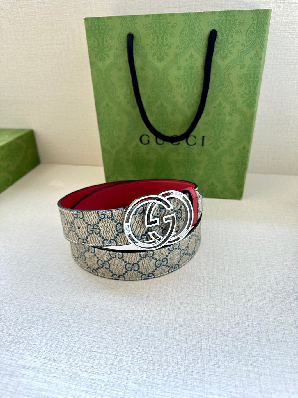 Gucci belt with blue GG canvas and silver-tone double-G buckle, red inner lining