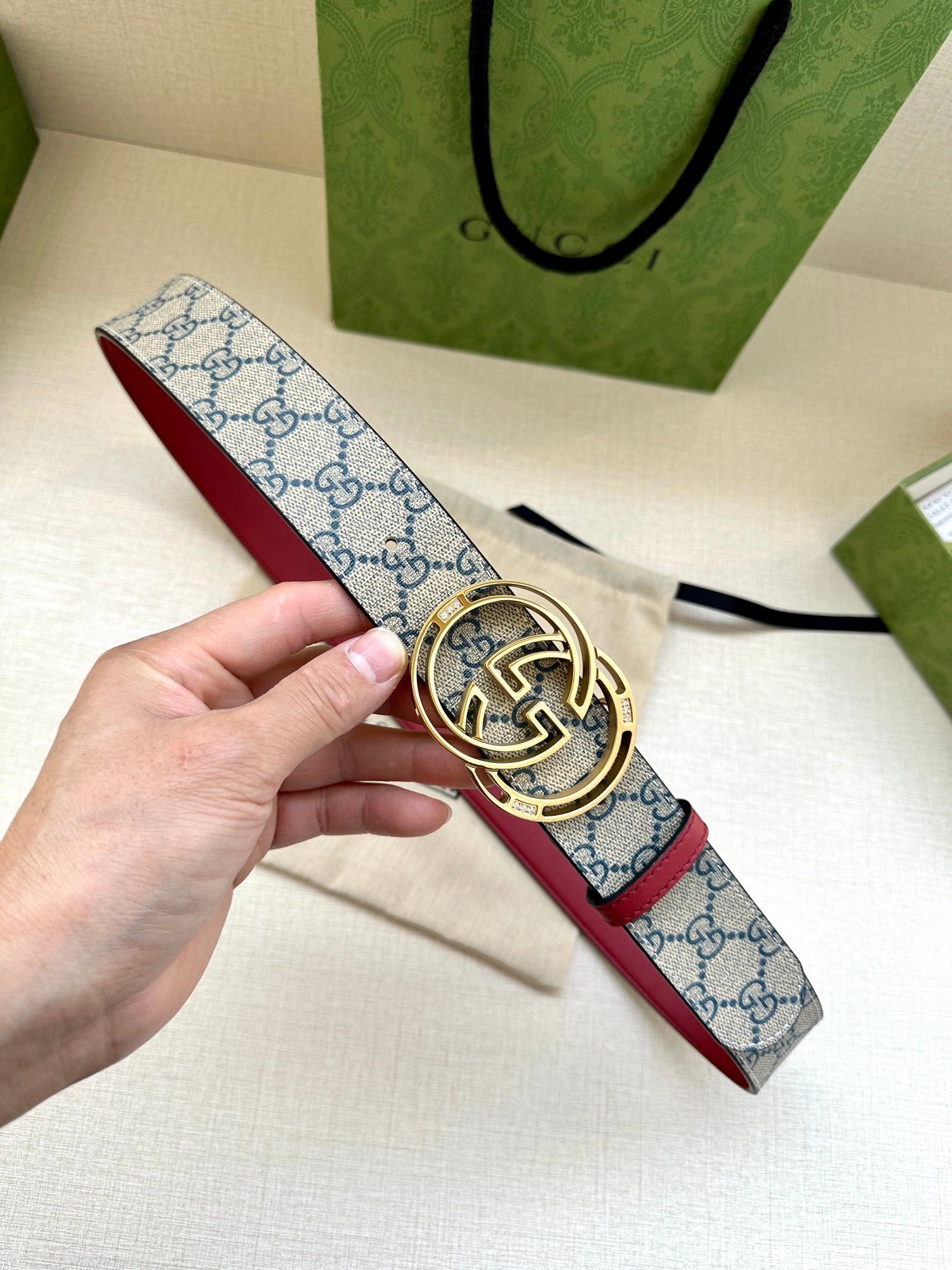 Gucci belt with blue GG canvas strap and gold-tone double-G buckle
