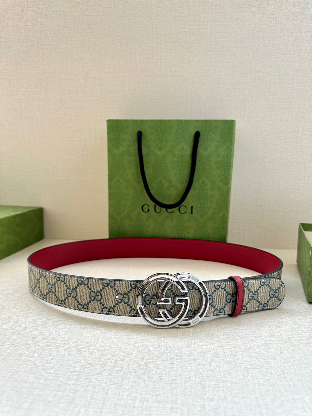 Gucci belt with blue GG canvas and red lining, silver-tone double-G buckle
