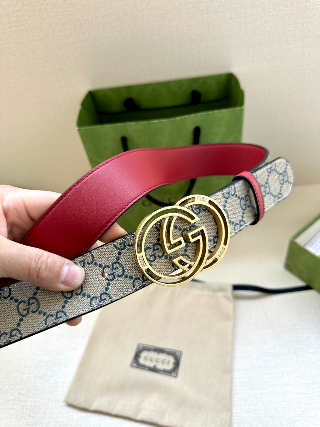 Gucci belt with red leather top and blue GG canvas, gold-tone double-G buckle