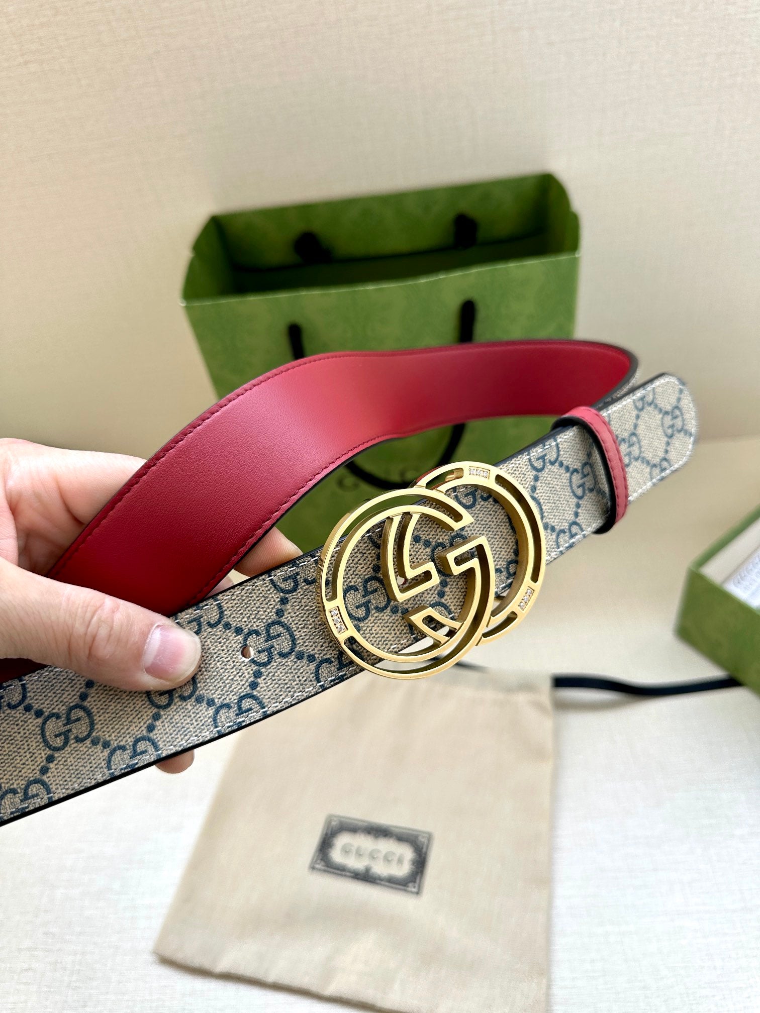 Gucci belt with red leather top and blue GG canvas, gold-tone double-G buckle