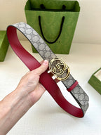 Gucci belt held up: gray GG monogram strap with red edge and silver-tone GG buckle