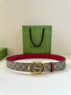Gucci belt with gray GG monogram strap, red leather trim, and gold-tone GG buckle