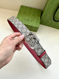 Gucci belt with gray GG monogram strap, red edge, and silver-tone GG buckle close-up