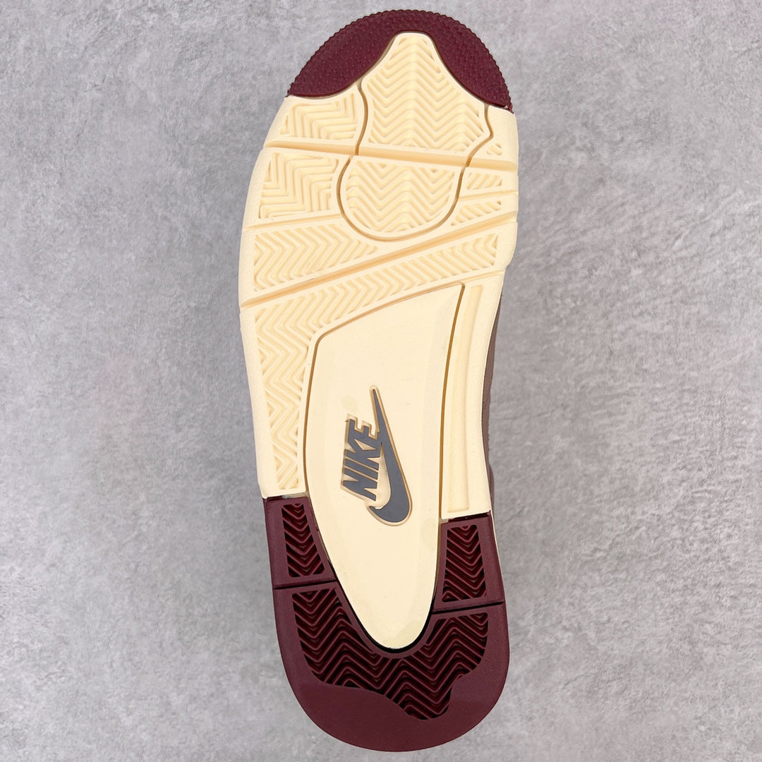 Jordan 4 retro outsole view with cream traction tread and burgundy forefoot edge