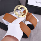 Gucci tan leather belt with round gold-tone GG buckle and keeper loop