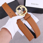 Gucci belt in tan leather with round gold-tone GG buckle and stitched strap