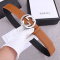 Gucci belt in tan leather with round silver-tone GG buckle and perforated holes
