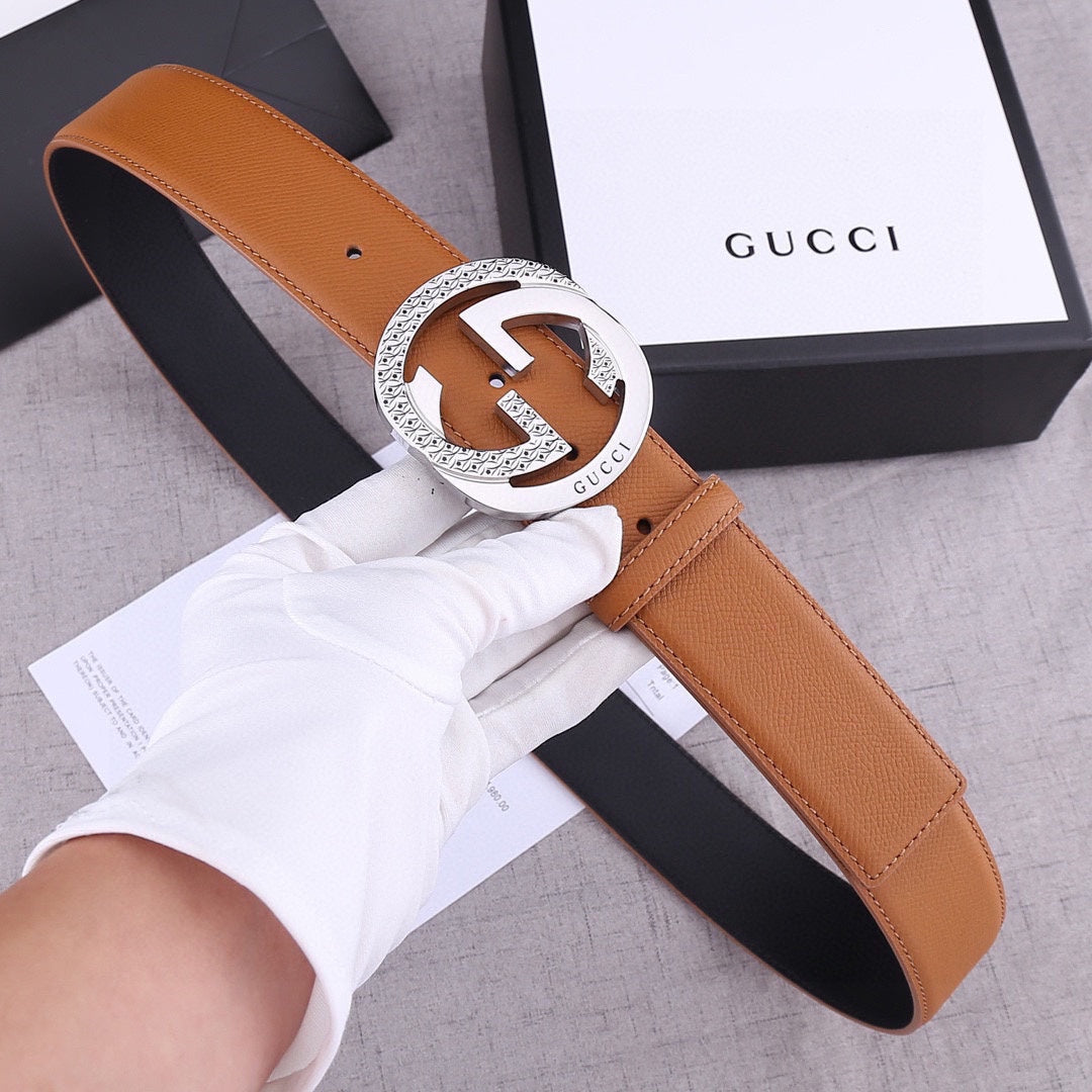 Gucci belt in tan leather with round silver-tone GG buckle and perforated holes
