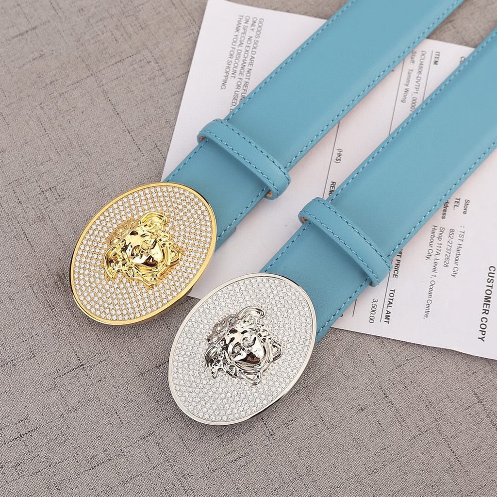 Light blue belts with round rhinestone medallion buckles: gold and silver lion designs