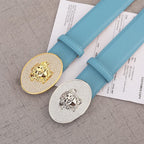 Light blue belts with round rhinestone medallion buckles: gold and silver lion designs