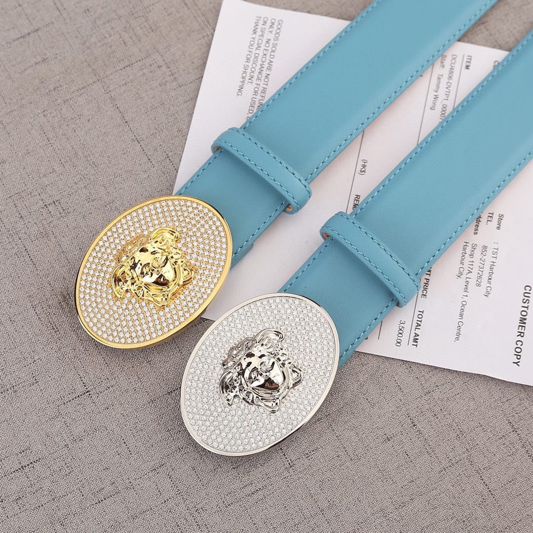 Light blue belts with round rhinestone medallion buckles: gold and silver lion designs