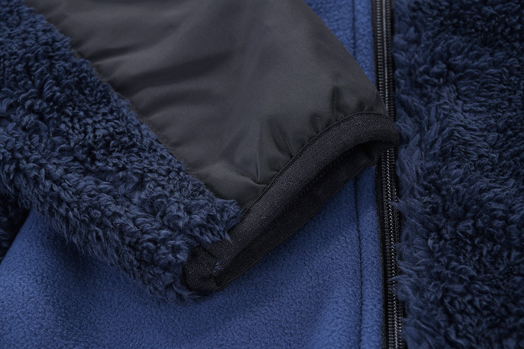 Fleece jacket cuff with inner gray lining and black zipper at seam