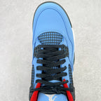 Light blue sneaker front with black laces, black mesh panel, and red heel detail
