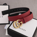 Red leather Gucci belt with gold double-G buckle and black inner strap