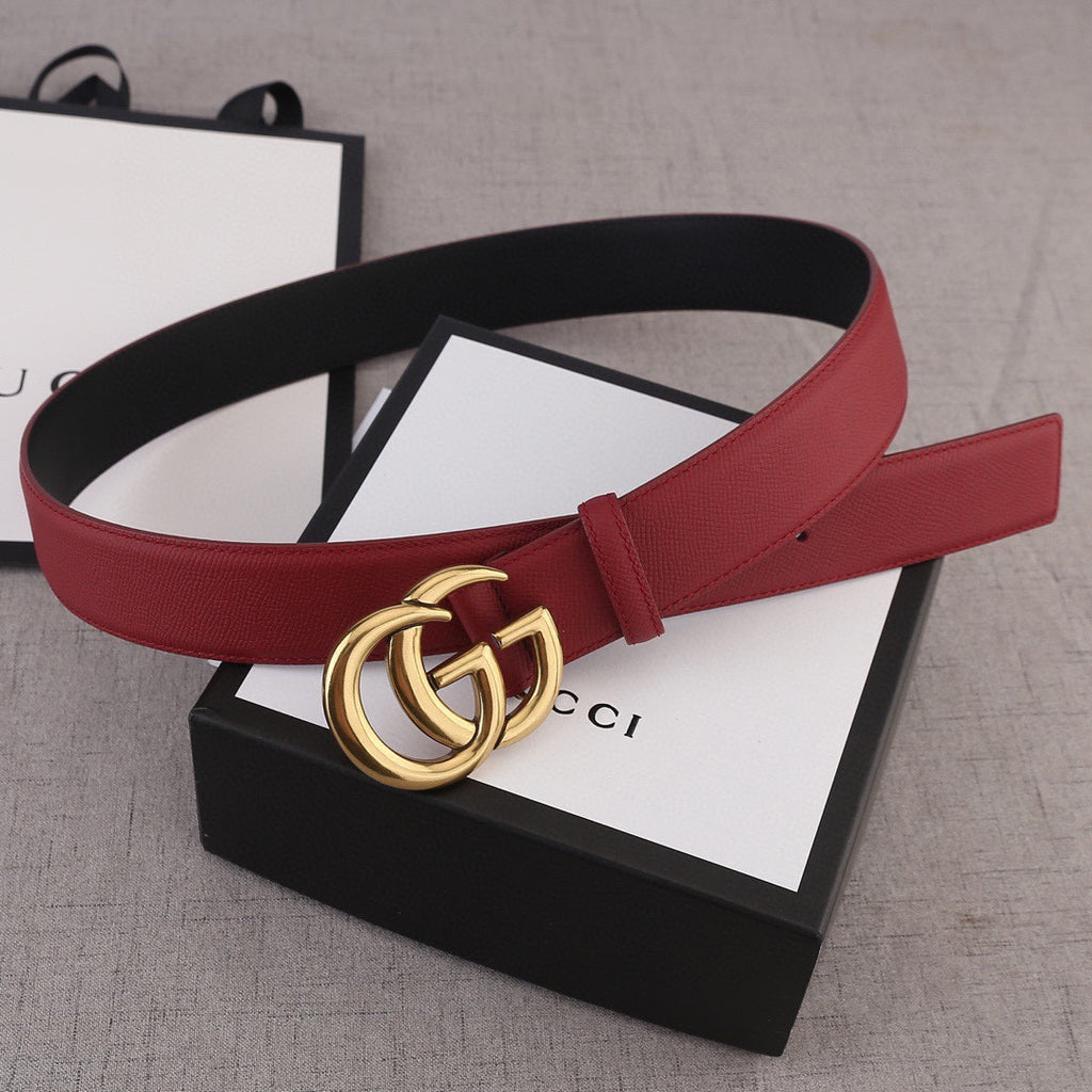 Red leather belt with gold double-G buckle on black base strap
