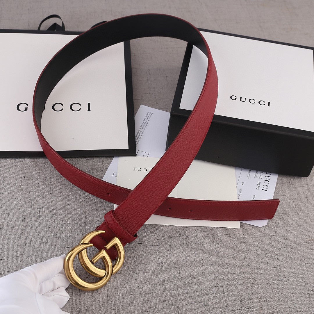 Red leather belt with gold double-G buckle end and black back strap
