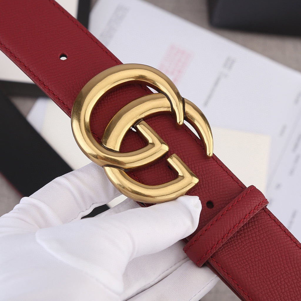 Red leather belt with gold double-G buckle and textured strap detail