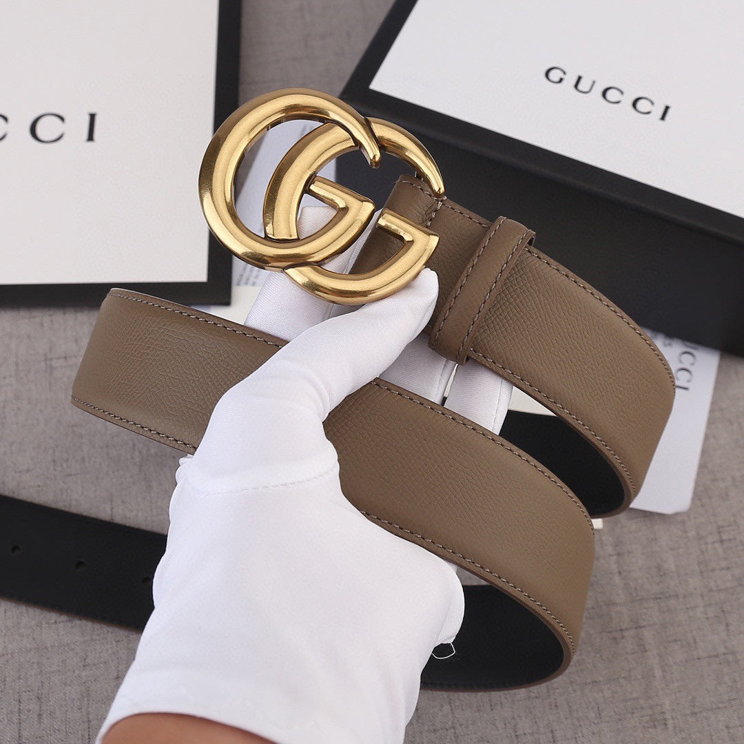 Brown leather belt with gold-tone interlocking G buckle at center