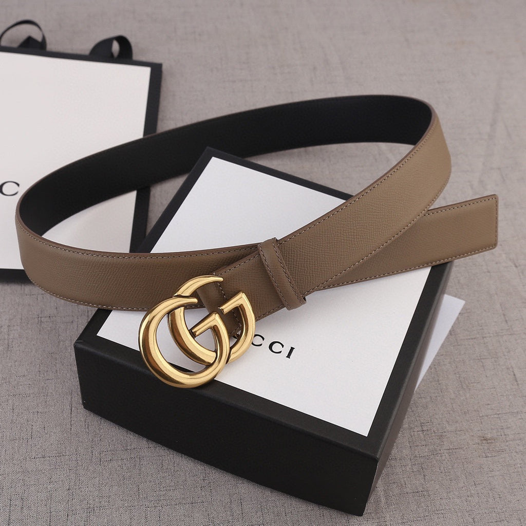 Brown leather belt with gold-tone GG buckle and smooth strap body