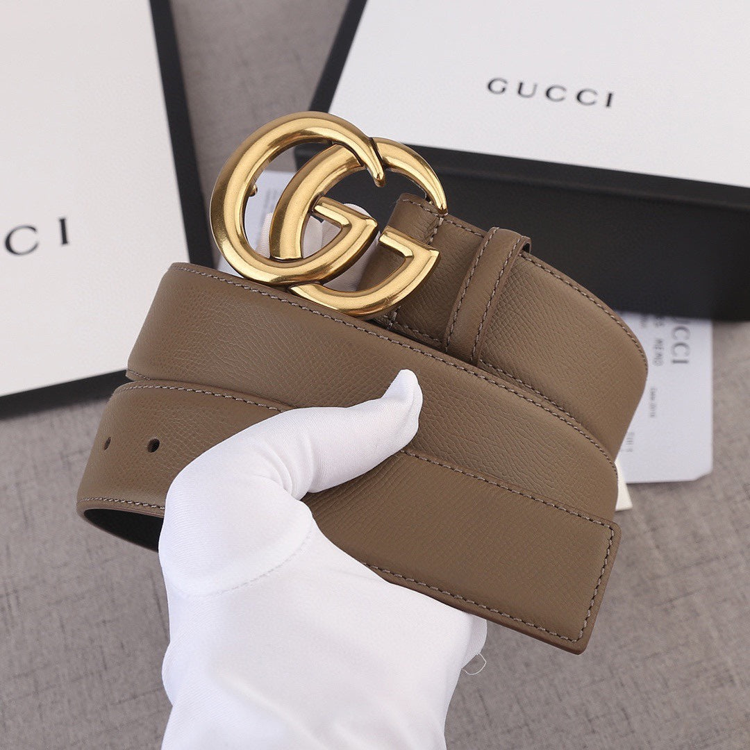 Brown leather belt with gold-tone double G buckle and wide strap
