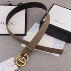 Brown leather belt with gold-tone GG buckle and leather strap loop