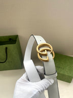 White leather belt with gold-tone double G buckle and punched holes