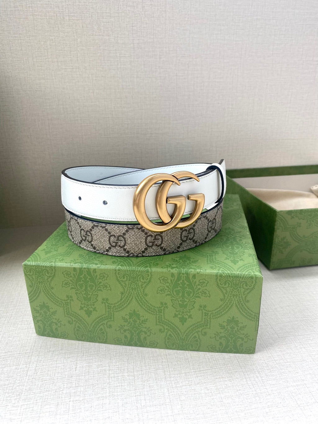 Gucci belt with monogram canvas band and gold-tone double G buckle
