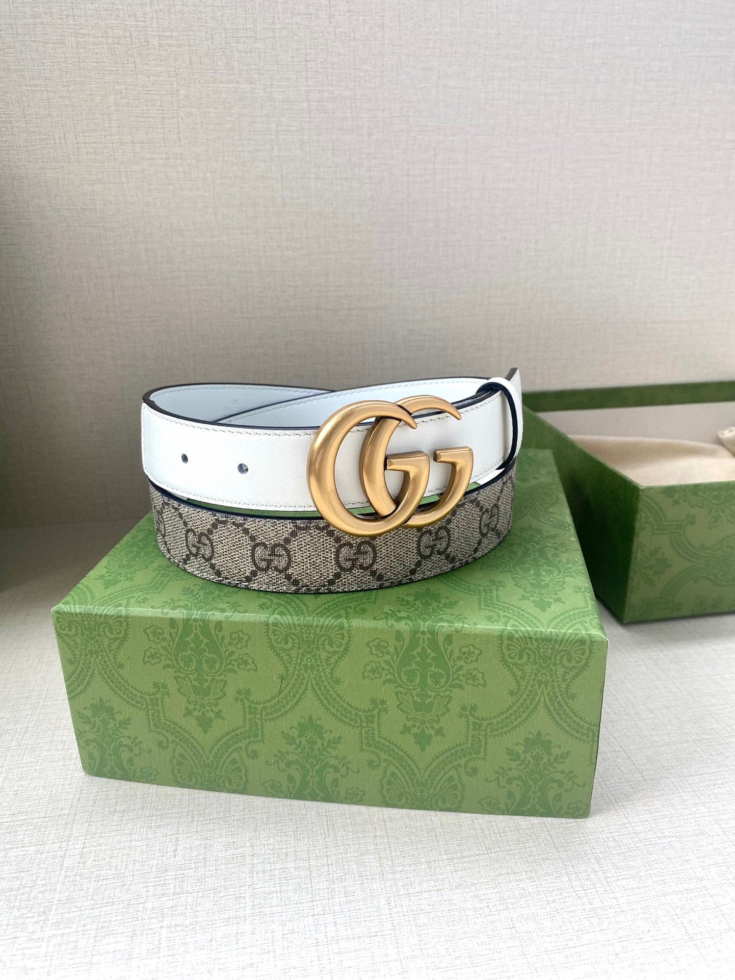 Gucci belt with monogram canvas band and gold-tone double G buckle
