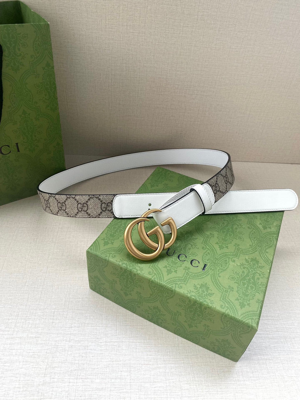 White leather Gucci belt with gold-tone double G buckle