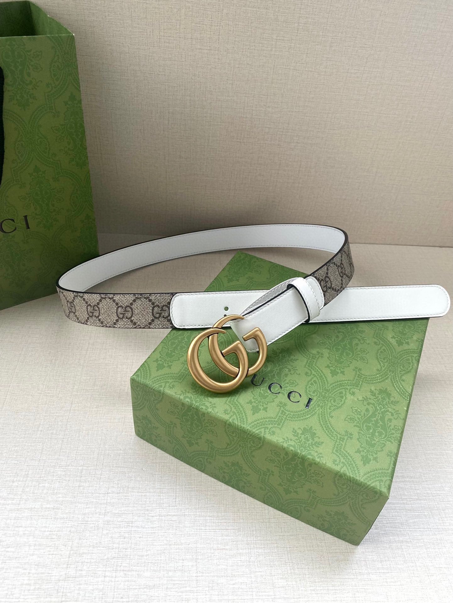 White leather Gucci belt with gold-tone double G buckle