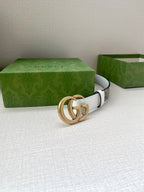 White leather belt with gold-tone double G buckle and no visible strap end