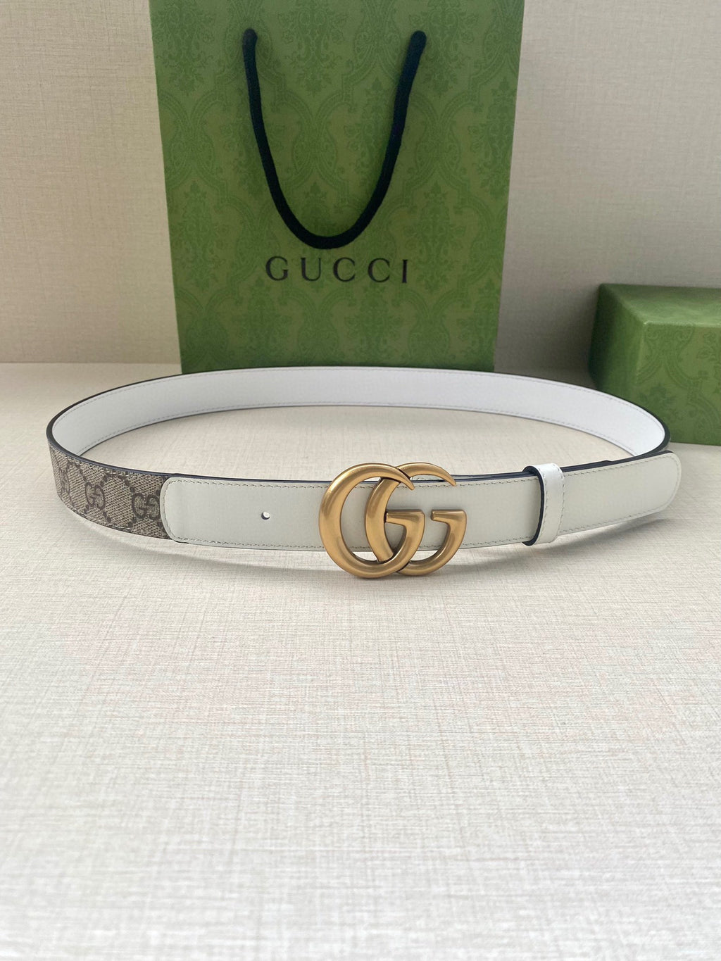 White leather Gucci belt with gold-tone double G buckle