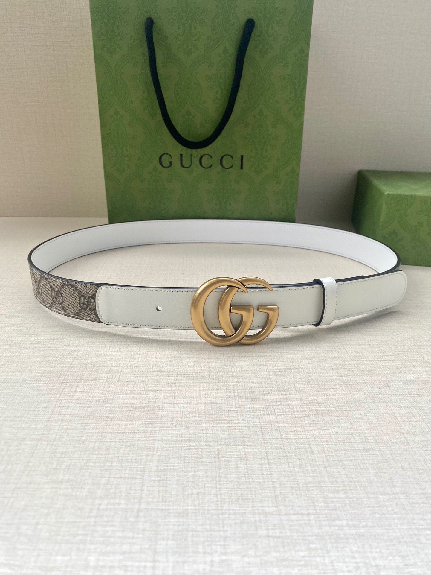 White leather Gucci belt with gold-tone double G buckle