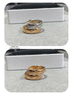 Chanel accessories rings: one silver-and-gold band and one gold band with diamond accents