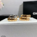 Chanel accessories rings: two stacked gold and silver bands with diamond accents, side view