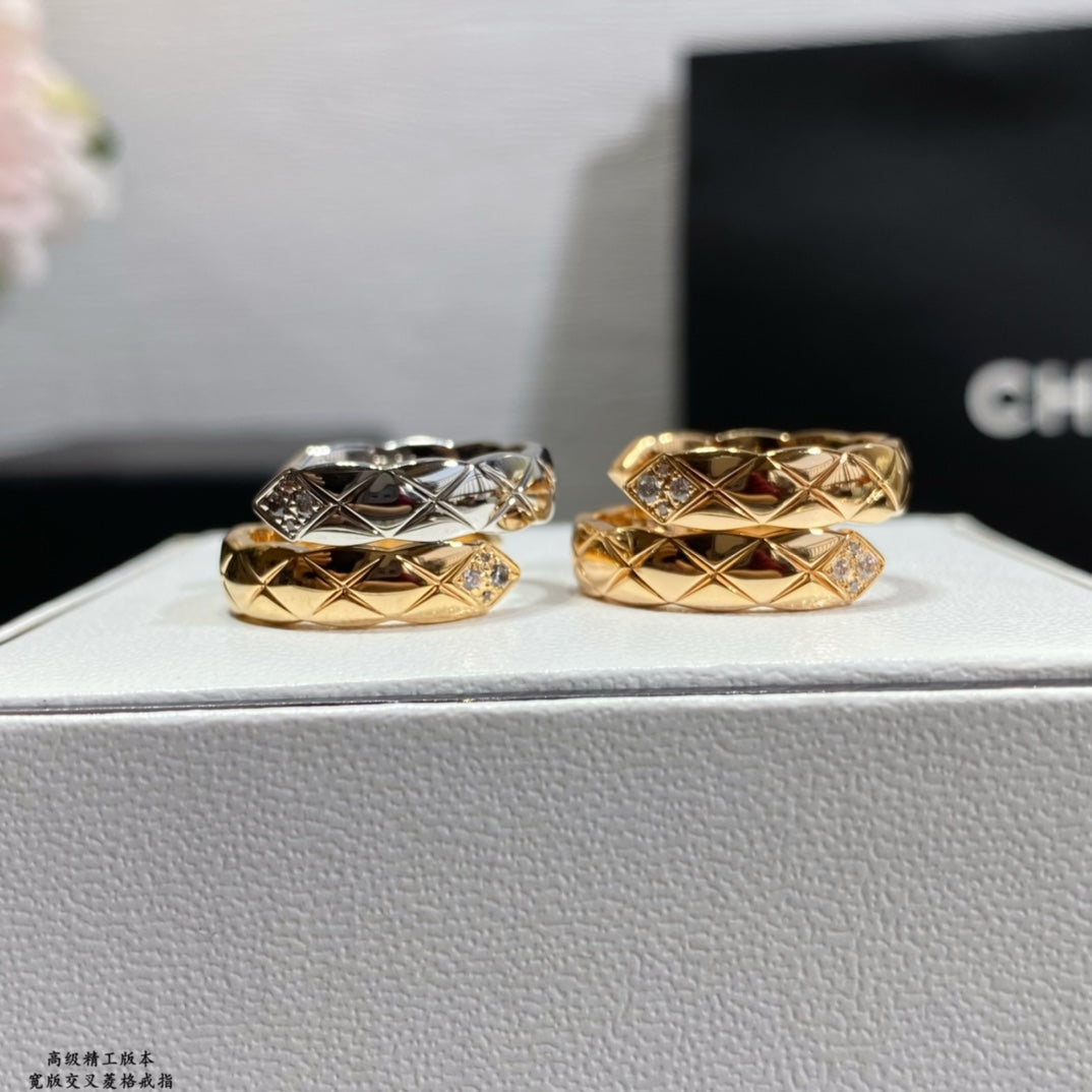 Chanel accessories rings: two stacked gold and silver bands with diamond accents, side view