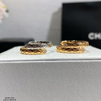 Two-tone ring set with silver-tone and gold-tone bands, diamond lattice pattern
