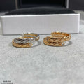 Gold-tone ring set of two with crisscross lattice and clear stone accents