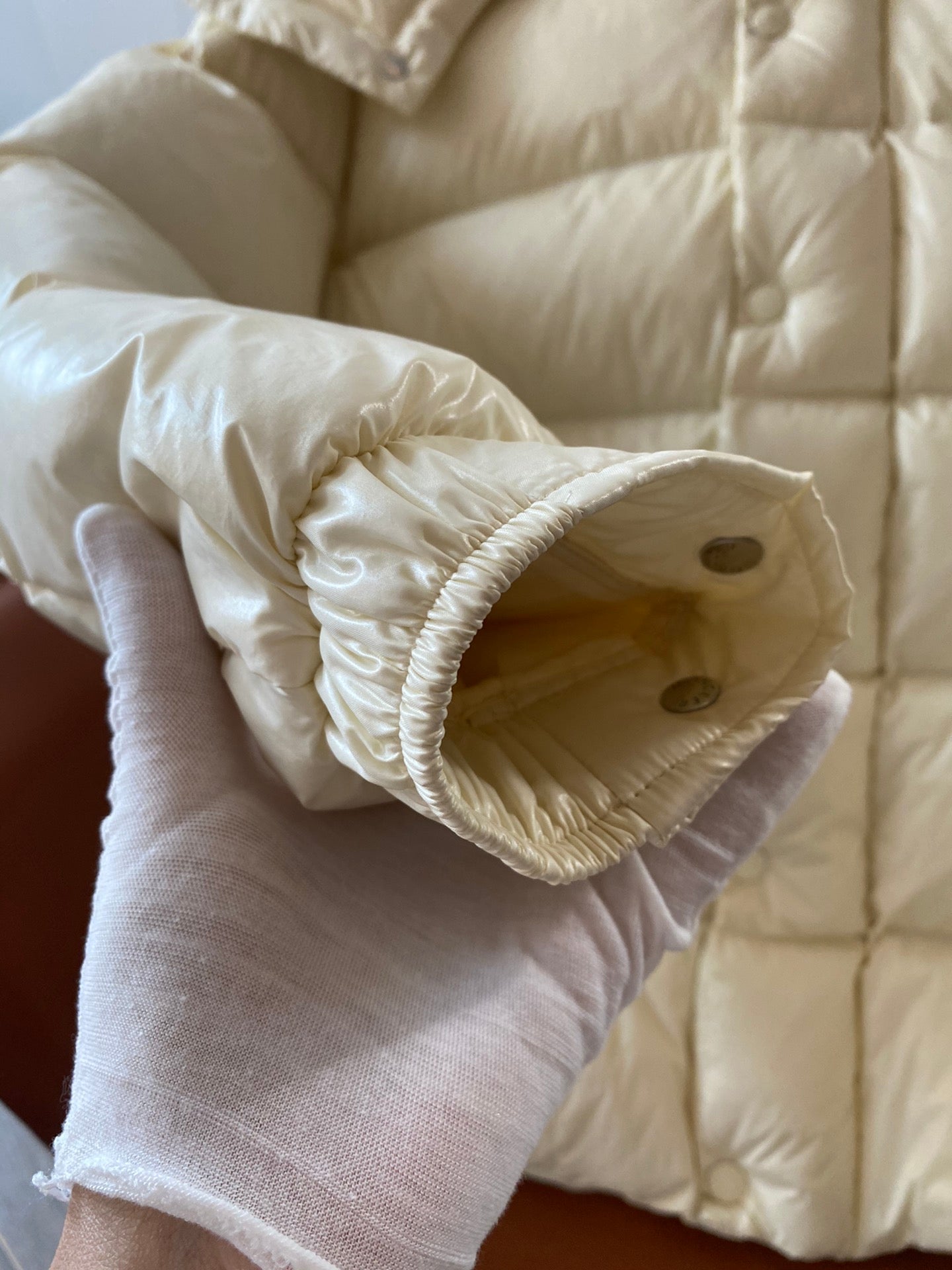 Moncler long cream puffer jacket sleeve cuff detail with button and elastic