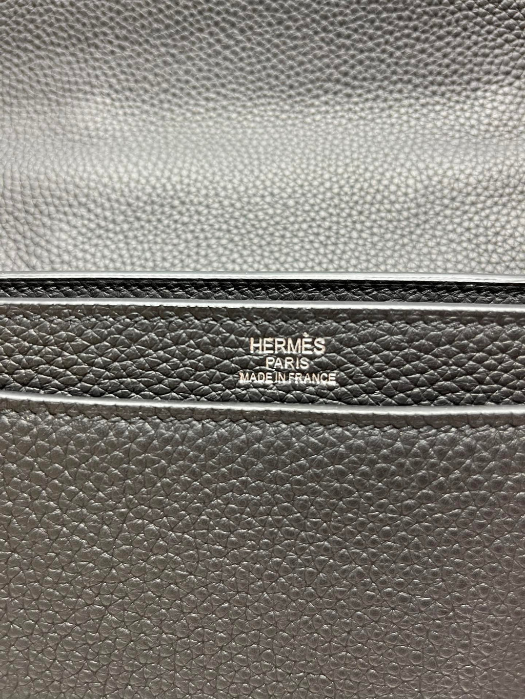 Leather satchel stamp reading "HERMES PARIS" and "MADE IN FRANCE"