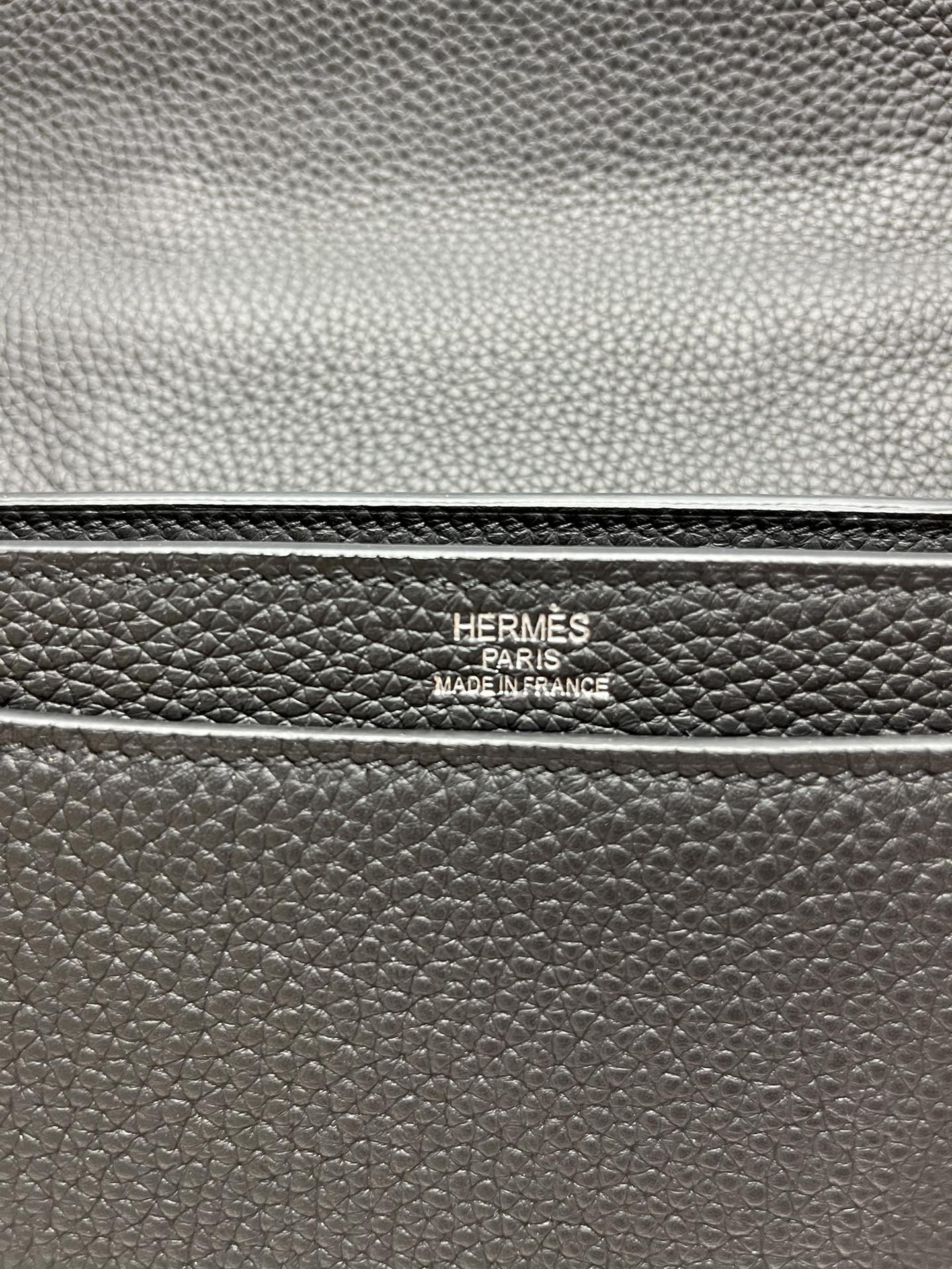 Leather satchel stamp reading "HERMES PARIS" and "MADE IN FRANCE"