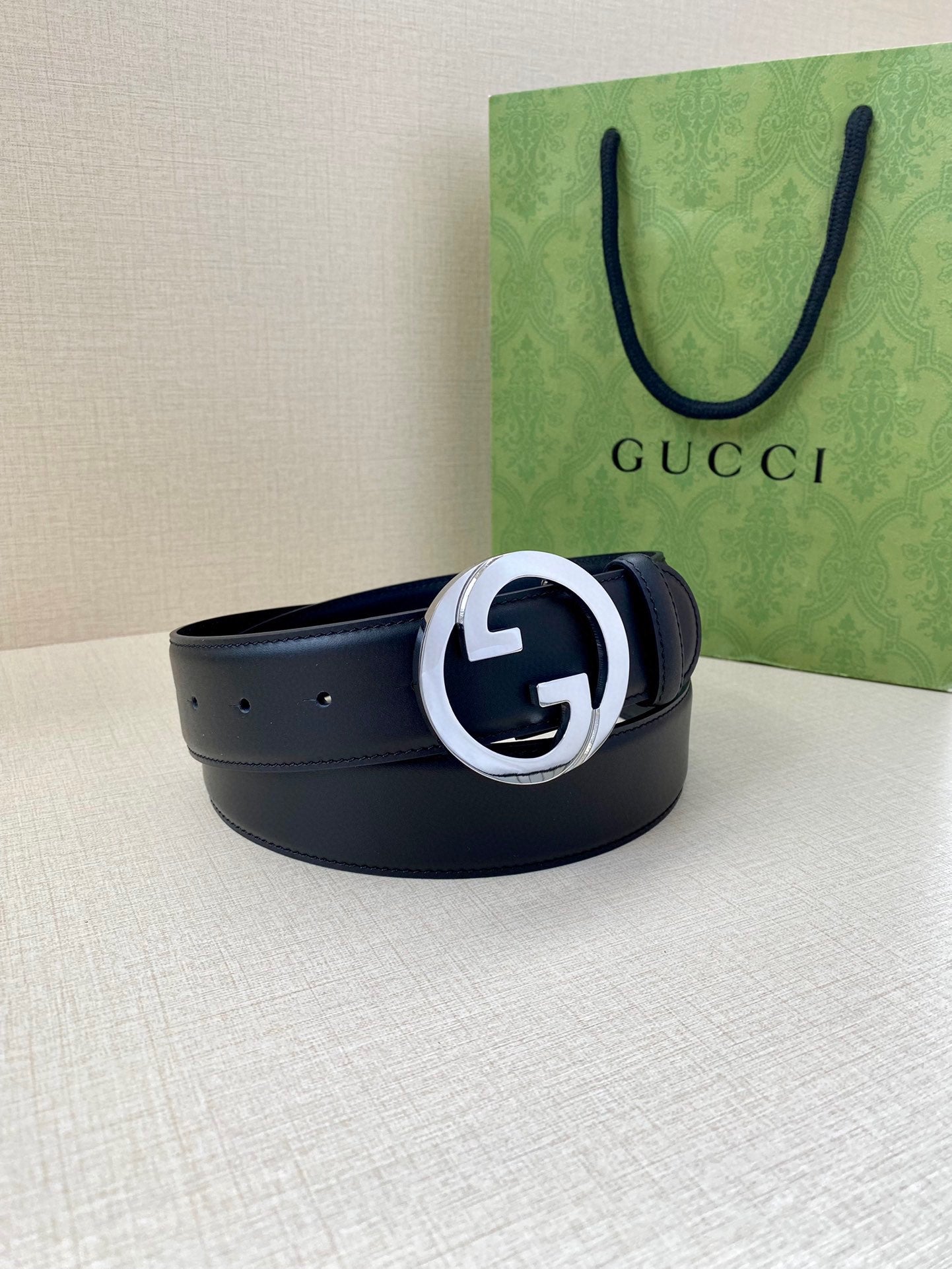 Gucci navy leather belt with wide strap and silver GG buckle