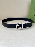 Gucci leather belt with navy strap and round silver GG buckle