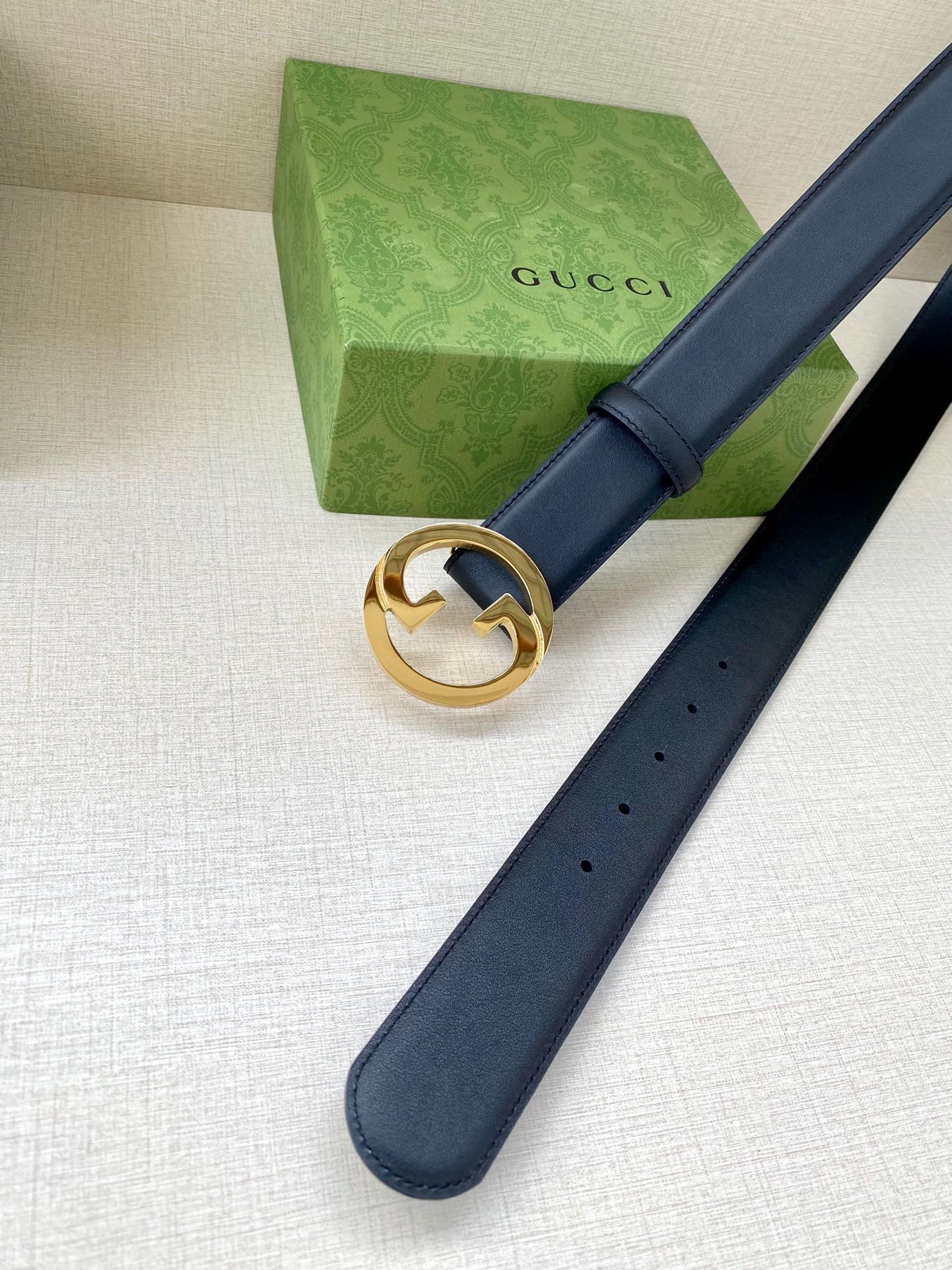 Gucci leather belt, dark blue with gold-tone interlocking G buckle